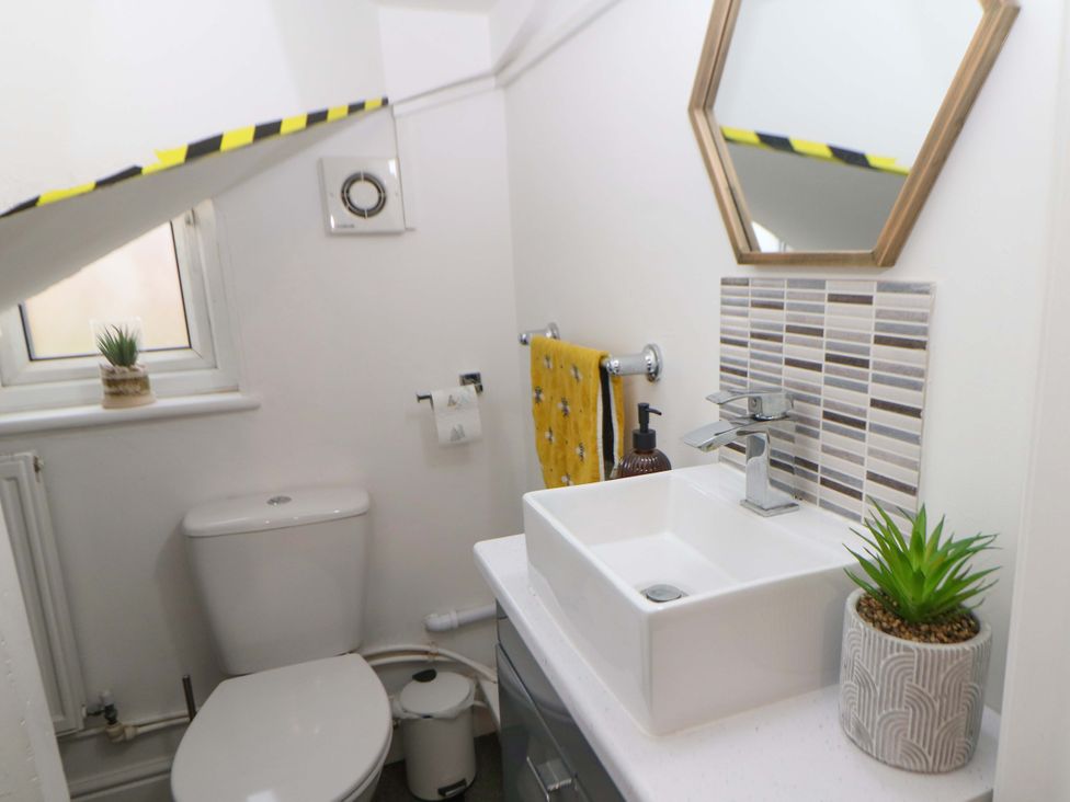 A bathroom with a sink and toilet at Nightingale House Stafford