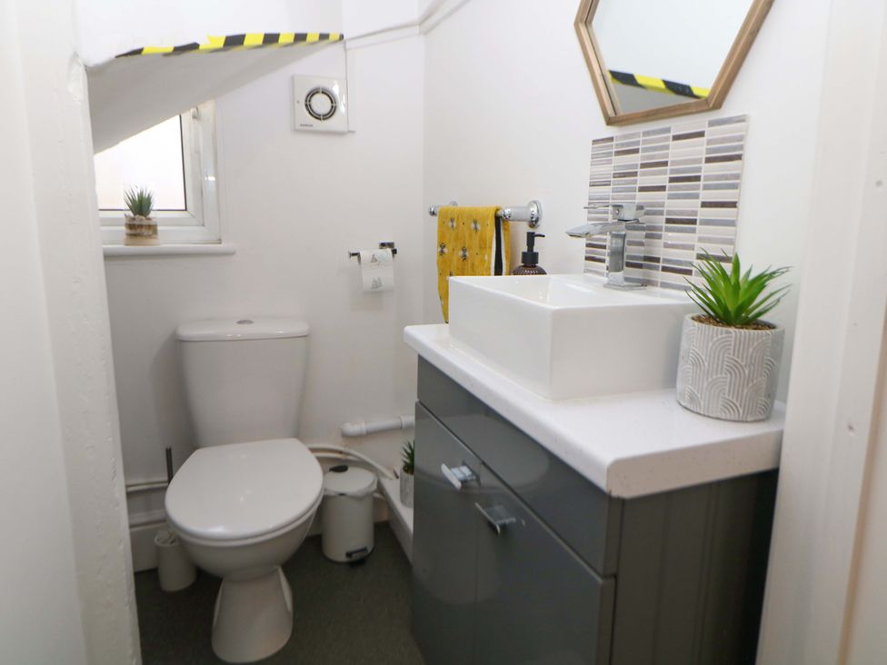 A bathroom with a sink and toilet at Nightingale House Stafford