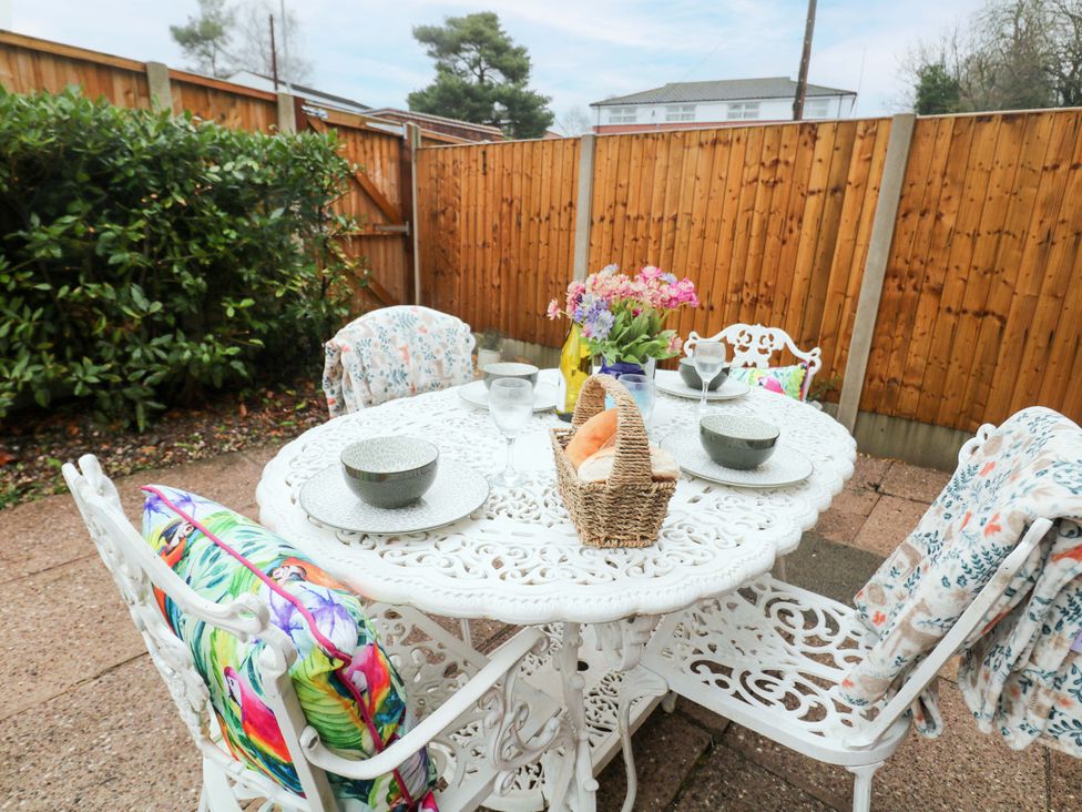 A garden setup with a table and chairs at Nightingale House Stafford