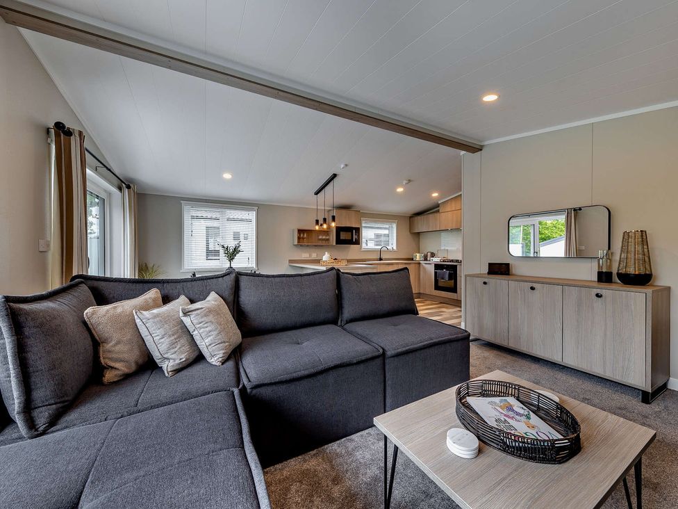 A living room with a sofa and coffee table at Saron 2.0 Pet Llandyrnog