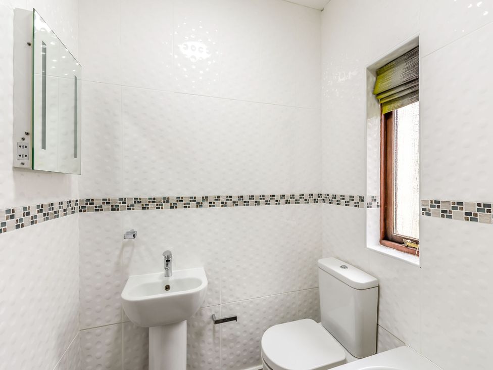 A bathroom with sink and toilet at Skiddaw in Penrith