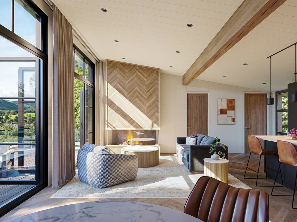 A living room with a sofa and armchair at Souther in Penrith