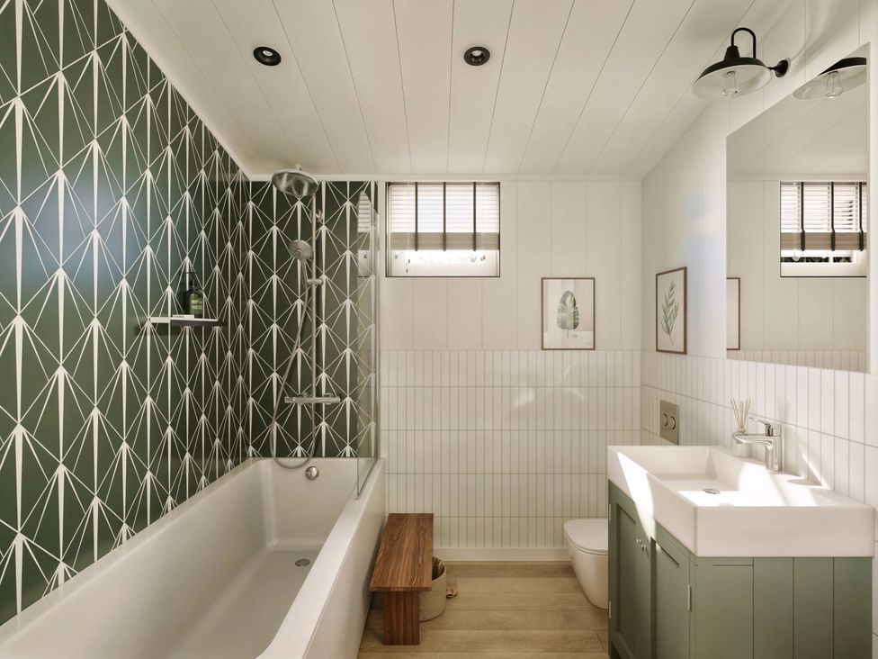 A bathroom with a bathtub and sink at Souther in Penrith