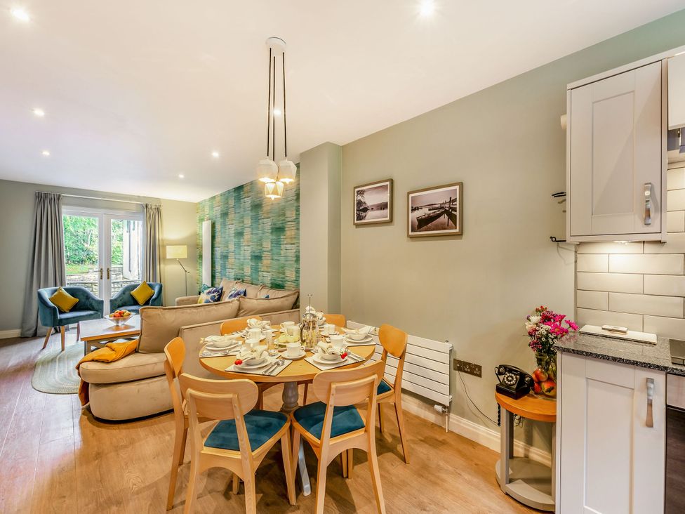 A dining room with table and chairs at The Troutbeck Den Spa Penrith