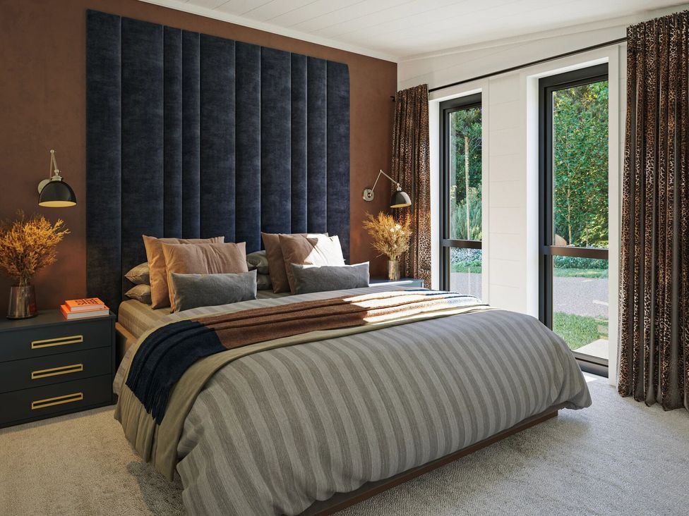 A bedroom with a bed and bedside table at Peak View in Penrith