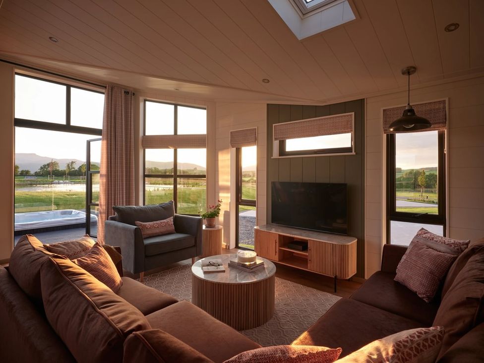 A living room with a sofa and a coffee table at Wansfell in Penrith