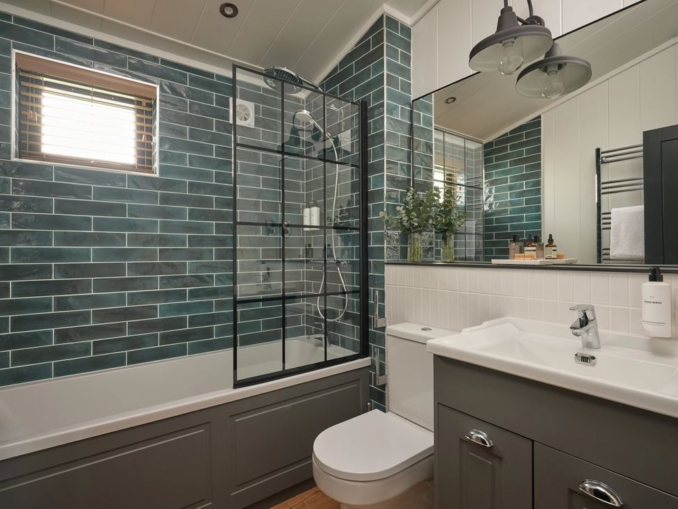 A bathroom with a shower and bathtub at Wansfell in Penrith