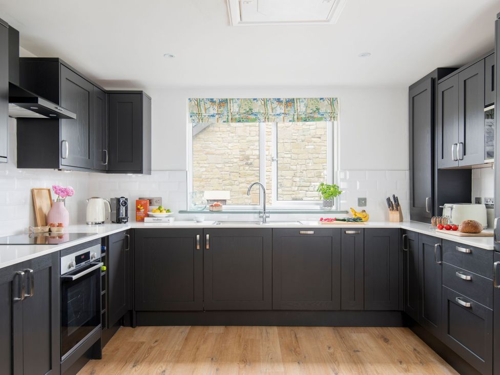 A kitchen featuring cabinets, a sink, and countertop at Patterdale (Pet) Penrith
