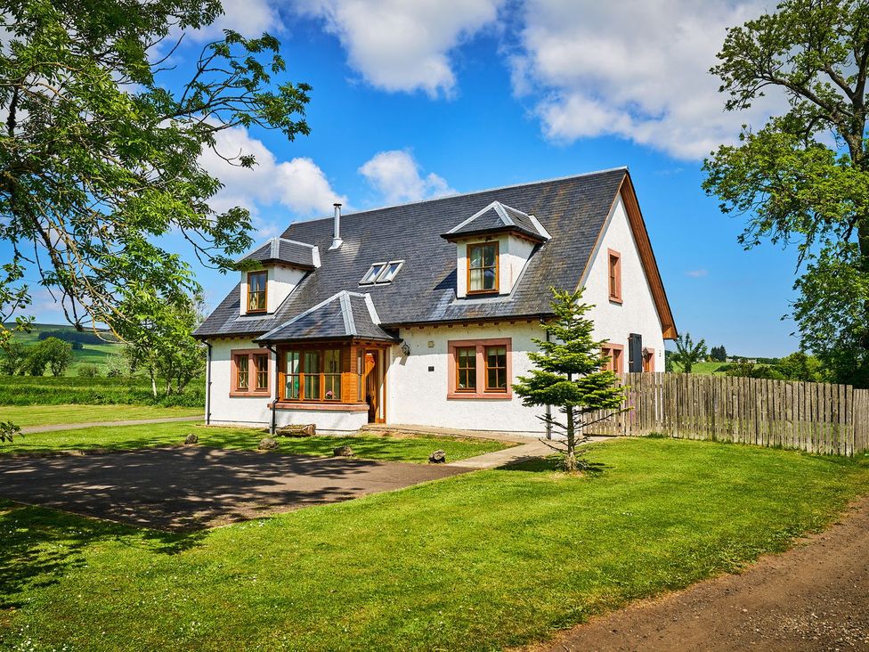 A house with a sloped roof and windows on the facade at Holly House in Blairgowrie