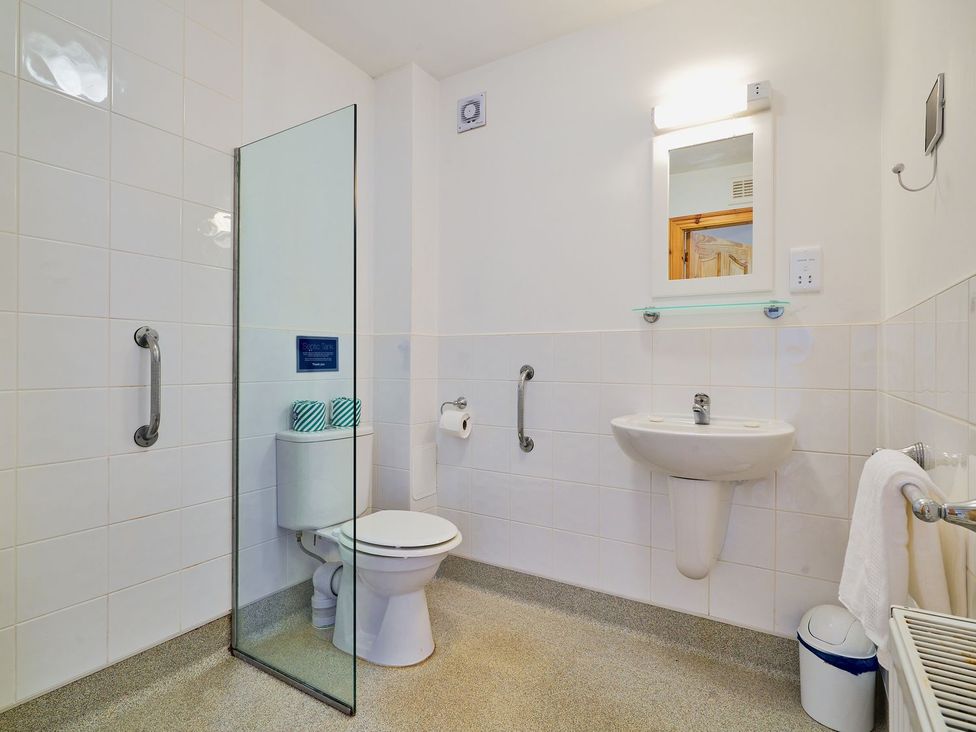 A bathroom with a shower and toilet at Holly House in Blairgowrie