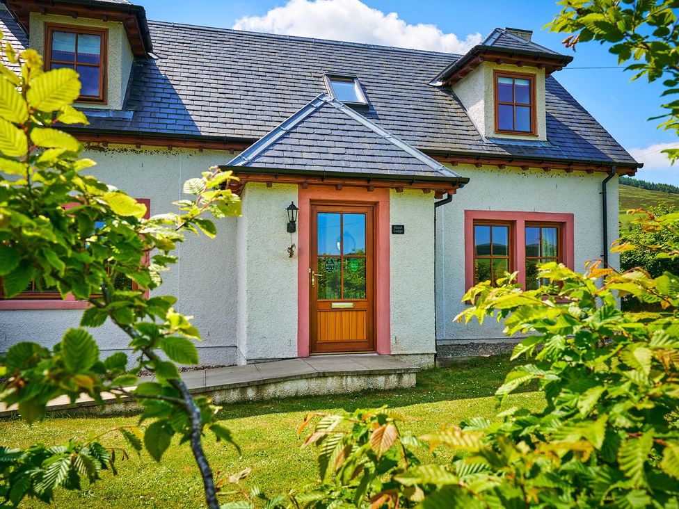 A house with a front door and windows at Hazel Lodge in Blairgowrie