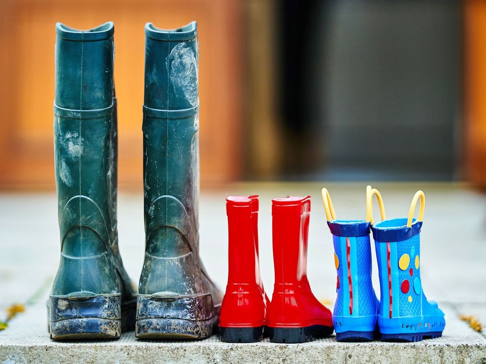 A row of rubber boots in various colors at Hazel Lodge in Blairgowrie
