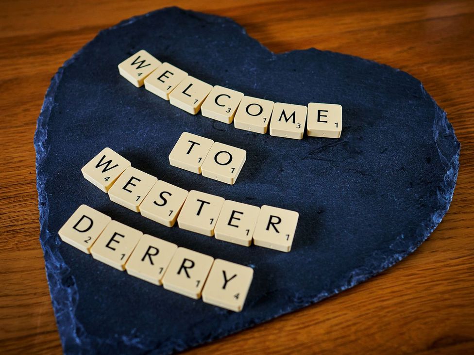 Welcome lettering made of letter tiles on slate at Hazel Lodge Blairgowrie