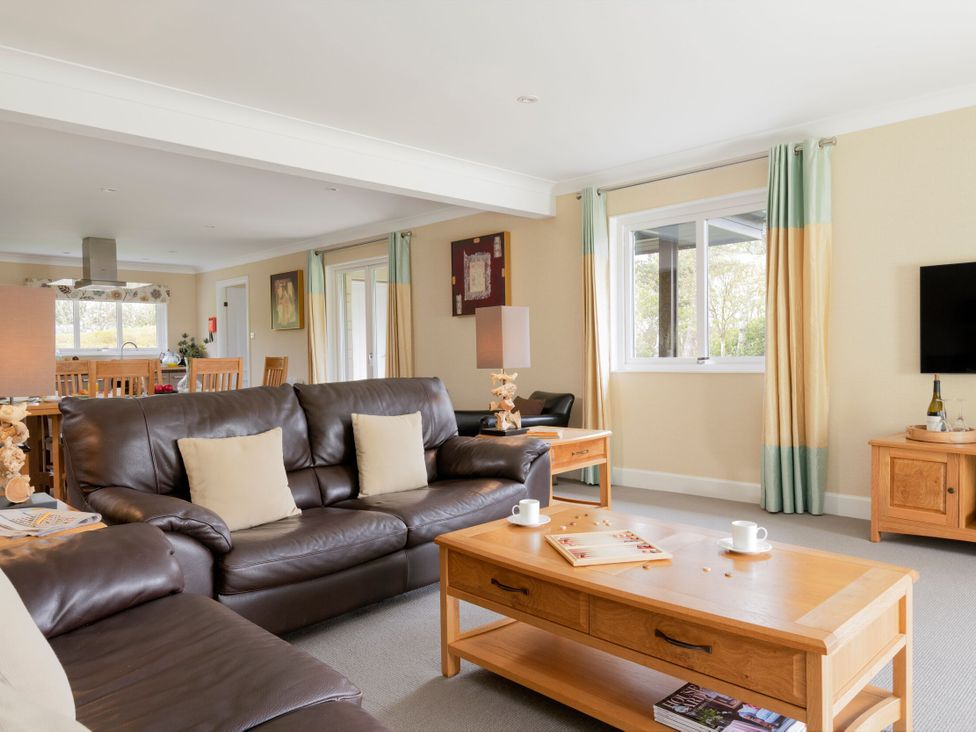 A living room with a sofa and table at The Allensford (Pet) Slaley
