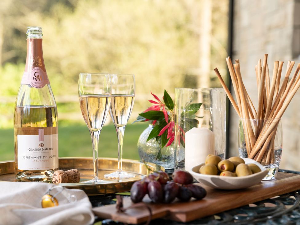 A table with wine glasses and snacks at The Allensford (Pet) in Slaley