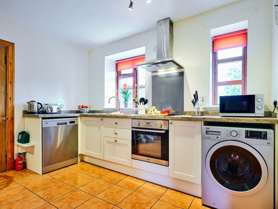 A kitchen with appliances and a fruit bowl at West Lodge in Kirriemuir