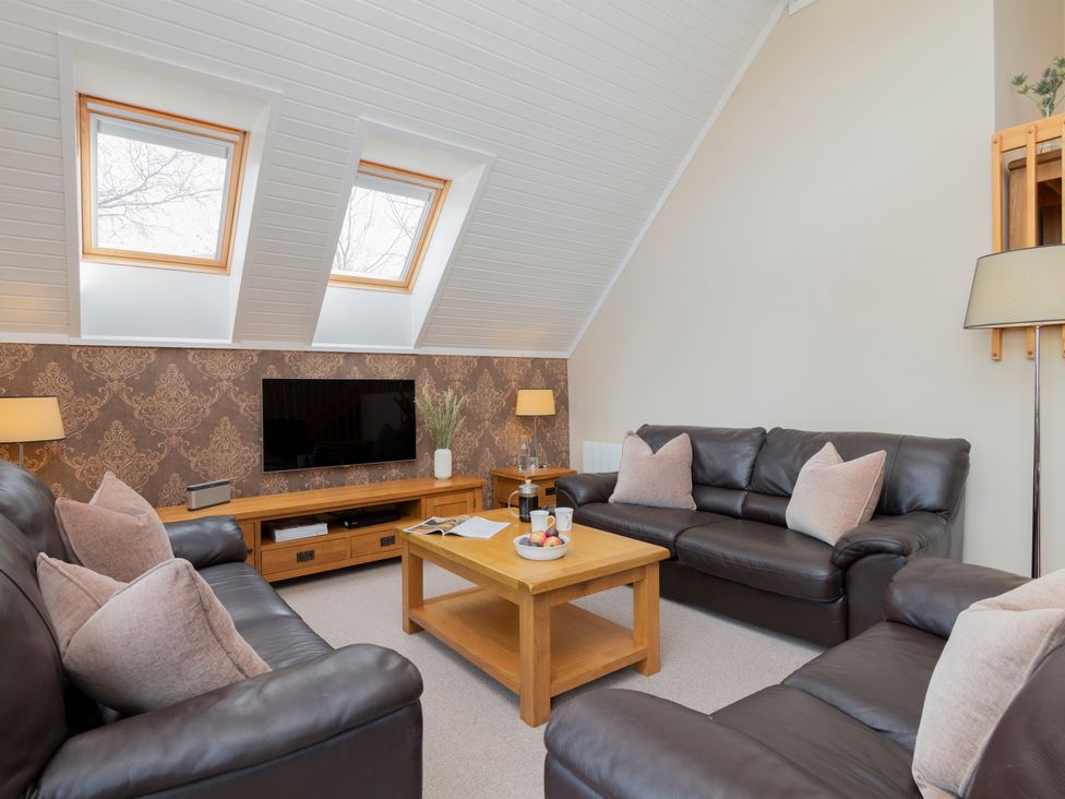 A living room with sofas and a coffee table at The Derwent in Slaley