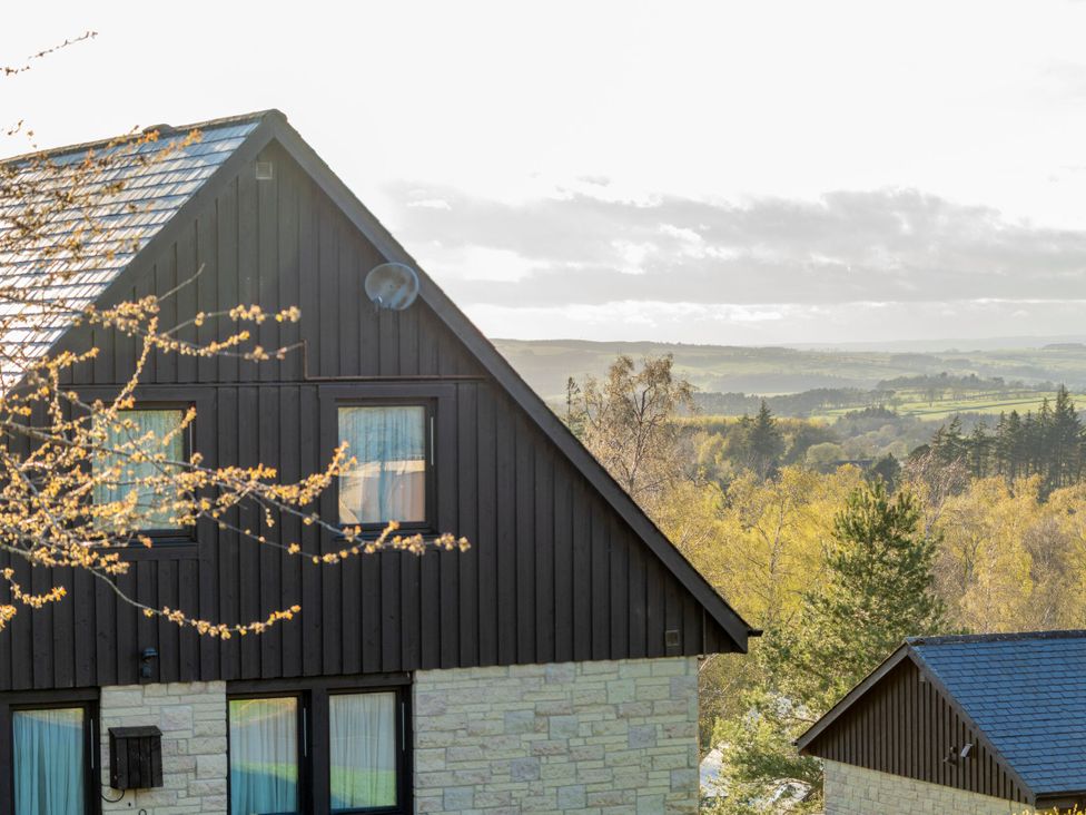 A view of a house with windows and trees at The Hexham in Slaley
