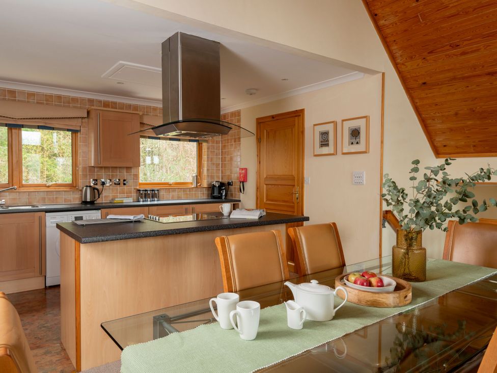 A kitchen with cabinets and an island at The Hexham in Slaley