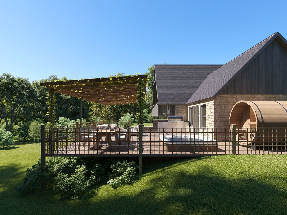 An outdoor area with a deck and seating at Heatherwood (Pet) Slaley