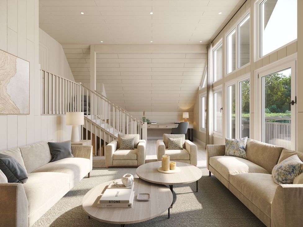 A living room with seating and a staircase at Heatherwood (Pet) in Slaley