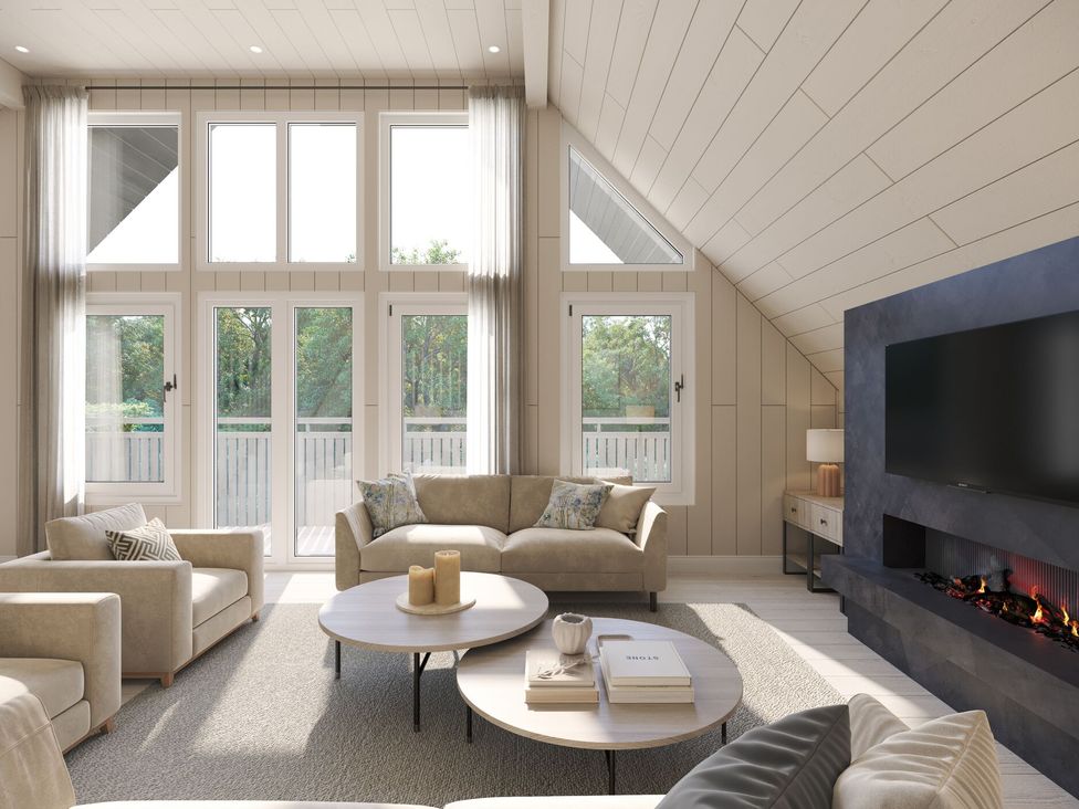 A living room with windows and a television at Heatherwood (Pet) Slaley