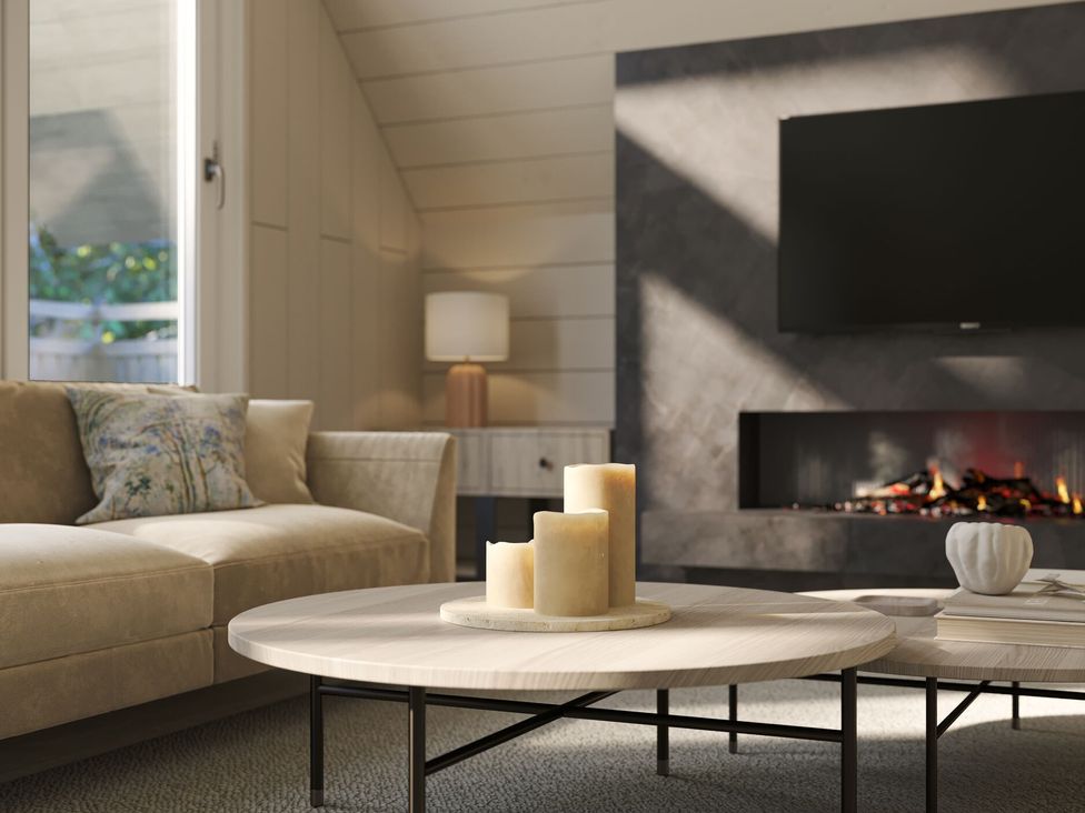 A living room with a coffee table and candles at Heatherwood (Pet) in Slaley