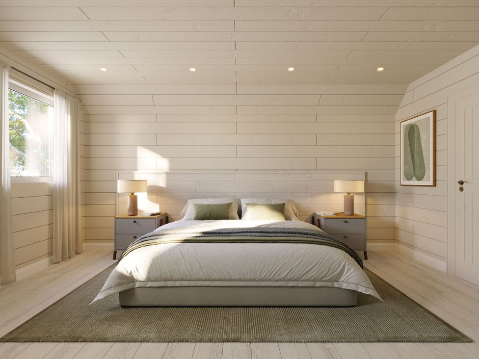 A bedroom with a bed and nightstands at Heatherwood (Pet) in Slaley