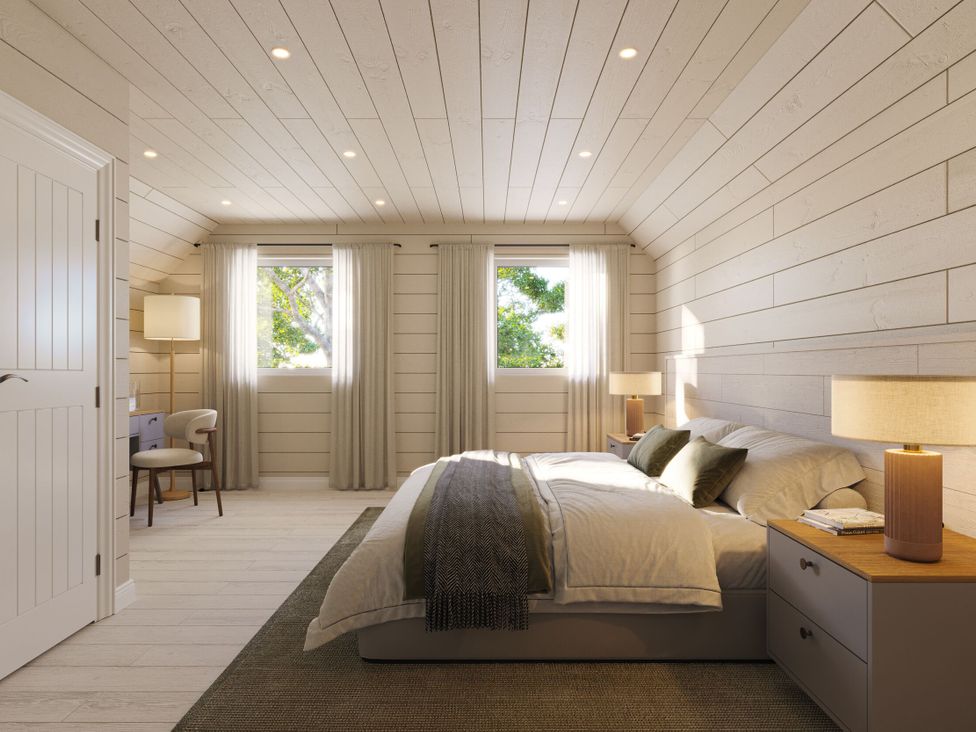 A bedroom with a bed and desk at Heatherwood (Pet) Slaley