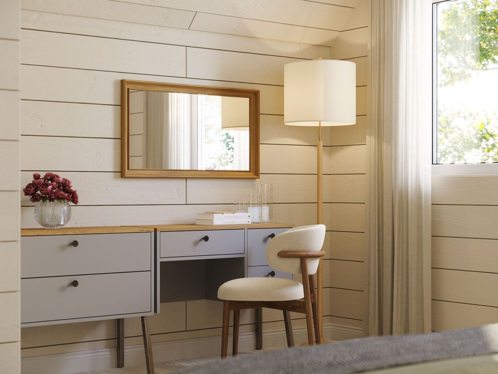 An office with a desk, lamp, and mirror at Heatherwood (Pet) in Slaley