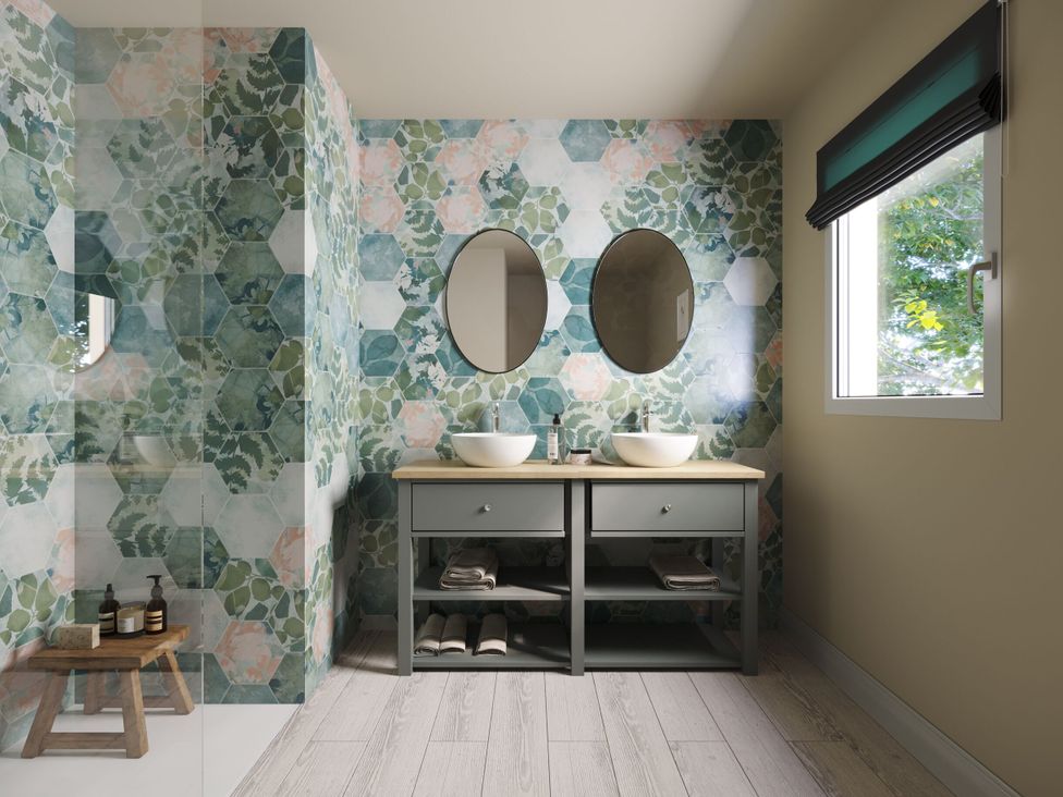 A bathroom with two sinks and mirrors at Heatherwood (Pet) in Slaley
