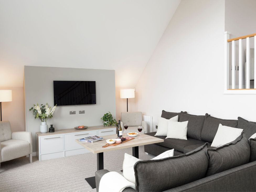 A living room with a sofa and coffee table at The Hexham Spa in Slaley