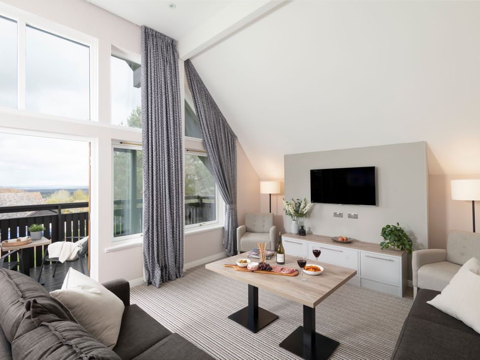 A living room with sofas and a coffee table at The Hexham Spa in Slaley