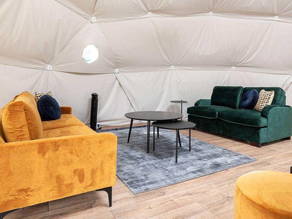 A living room with two sofas and a coffee table at The Dome in Great Ayton