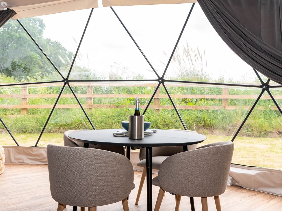 A dining area with a table and chairs at The Dome (Pet) in Great Ayton