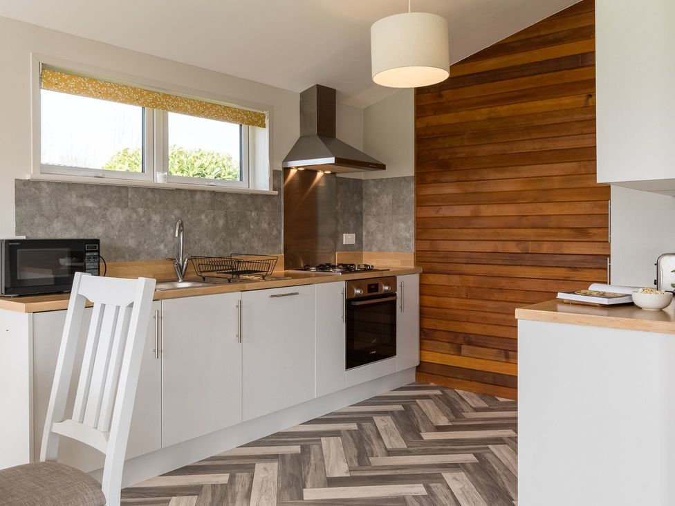 A kitchen with appliances and wood accents at Greystone in Great Ayton