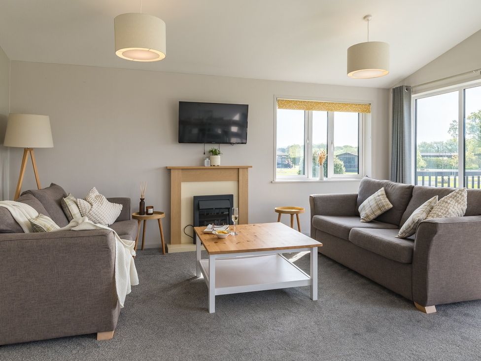 A living room with a sofa and coffee table at Greystone in Great Ayton