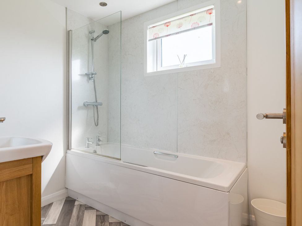 A bathroom with a bathtub and shower at Greystone in Great Ayton