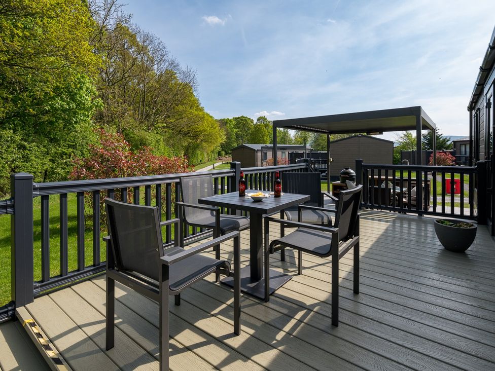 An outdoor patio with a table and chairs at The Woods in Great Ayton