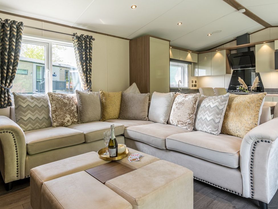 A living room with a sofa and coffee table at The Woods in Great Ayton