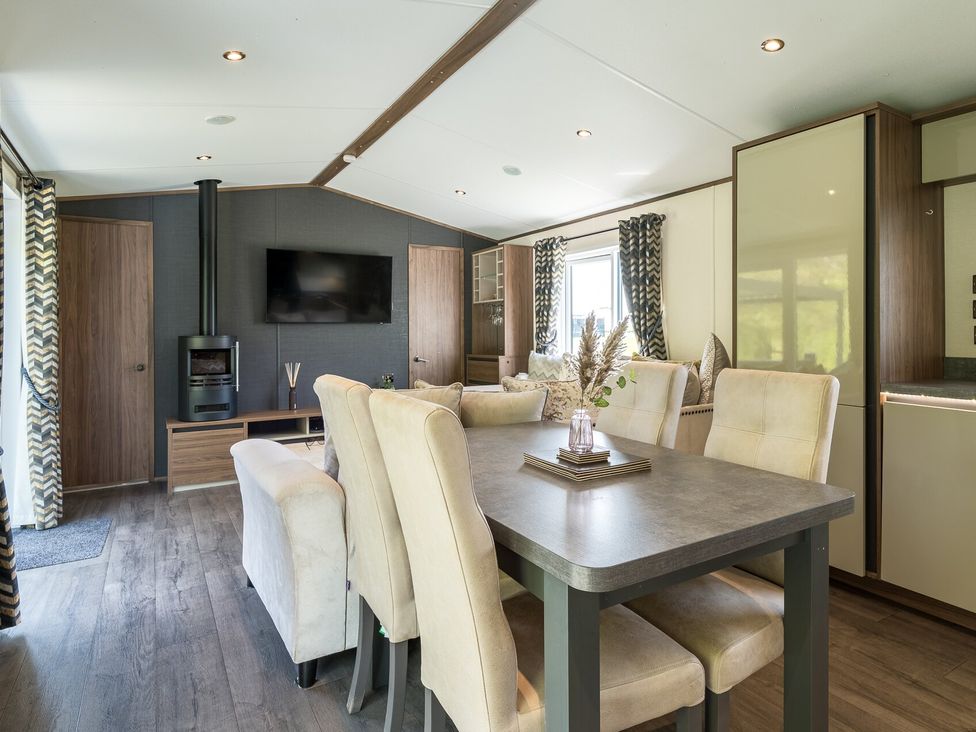 A dining room with a table and chairs at The Woods (Pet) Great Ayton