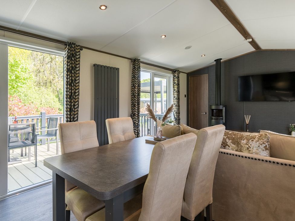 A dining room with chairs and a table at The Woods (Pet) Great Ayton
