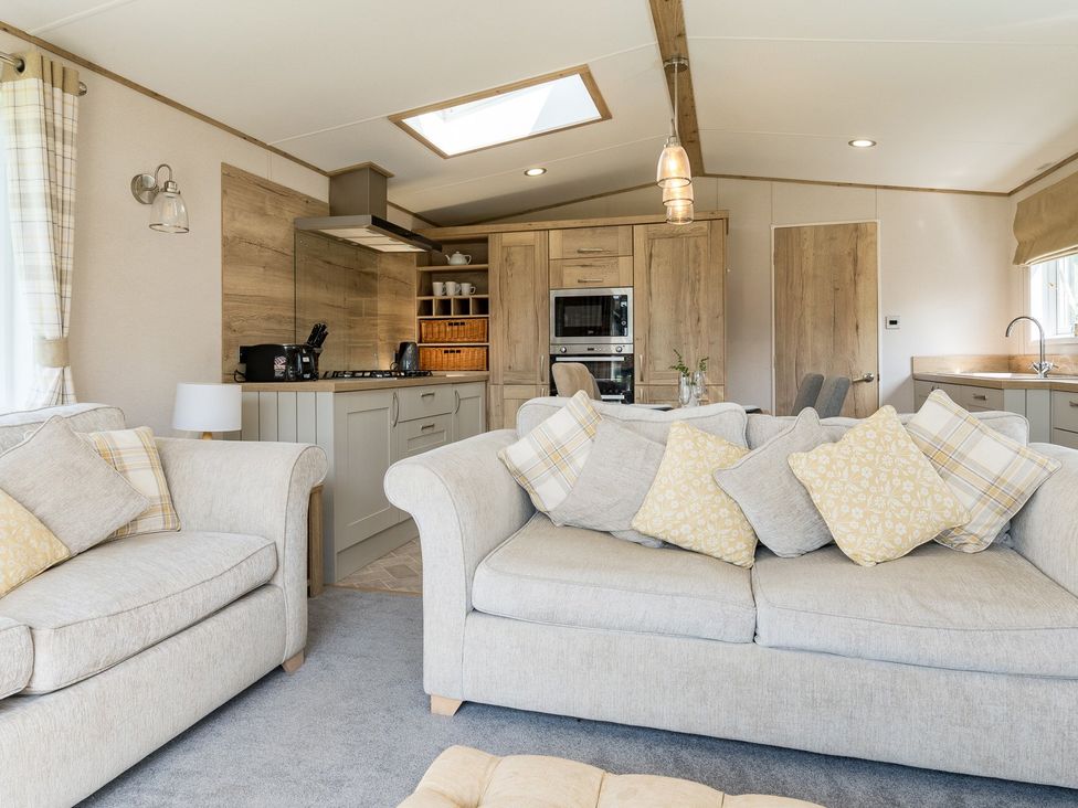 A living room with a kitchen area at Leven (Pet) Great Ayton