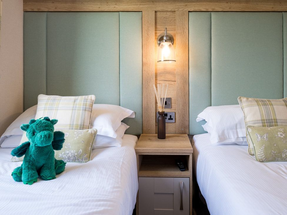 A bedroom with two beds and a plush toy at Leven (Pet) in Great Ayton