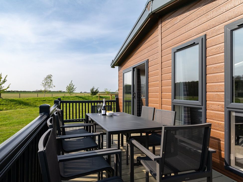 An outdoor patio with a table and chairs at Roseberry in Great Ayton