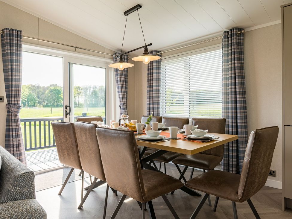 A dining room with a table and chairs at Roseberry in Great Ayton