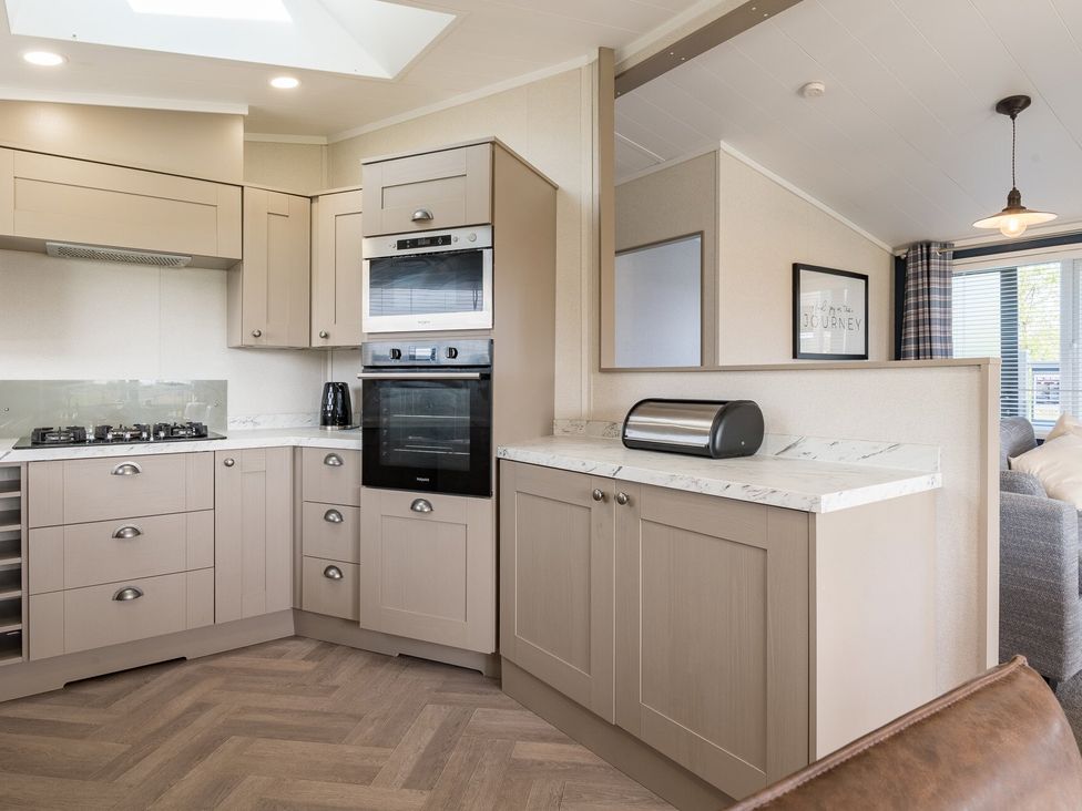 A kitchen with built-in appliances and countertops at Roseberry in Great Ayton