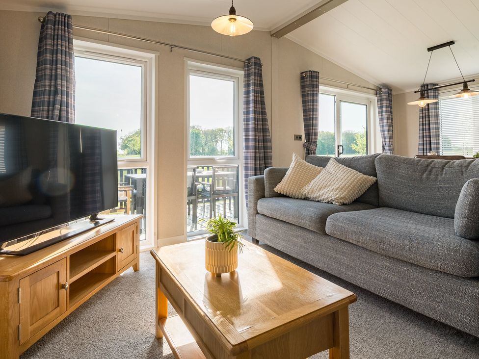 A living room with a television and coffee table at Roseberry in Great Ayton