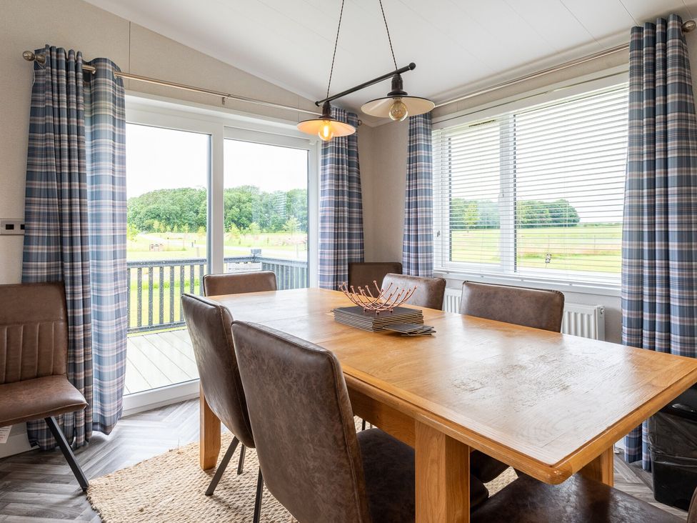 A dining room with a table and chairs at Roseberry in Great Ayton