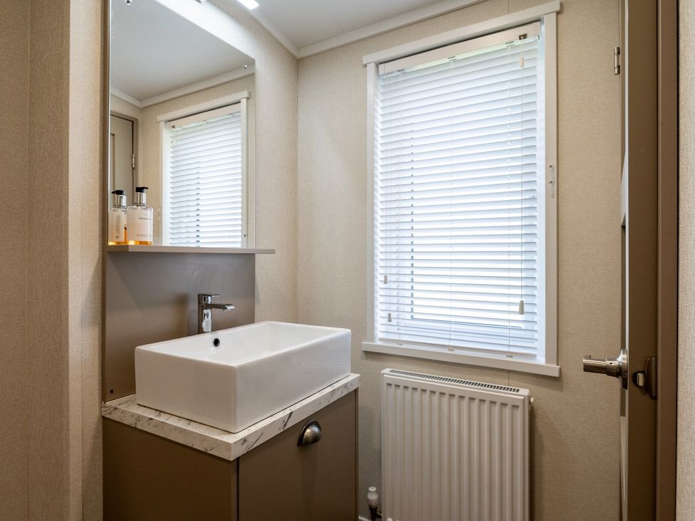 A bathroom with a sink and mirror at Roseberry (Pet) Great Ayton